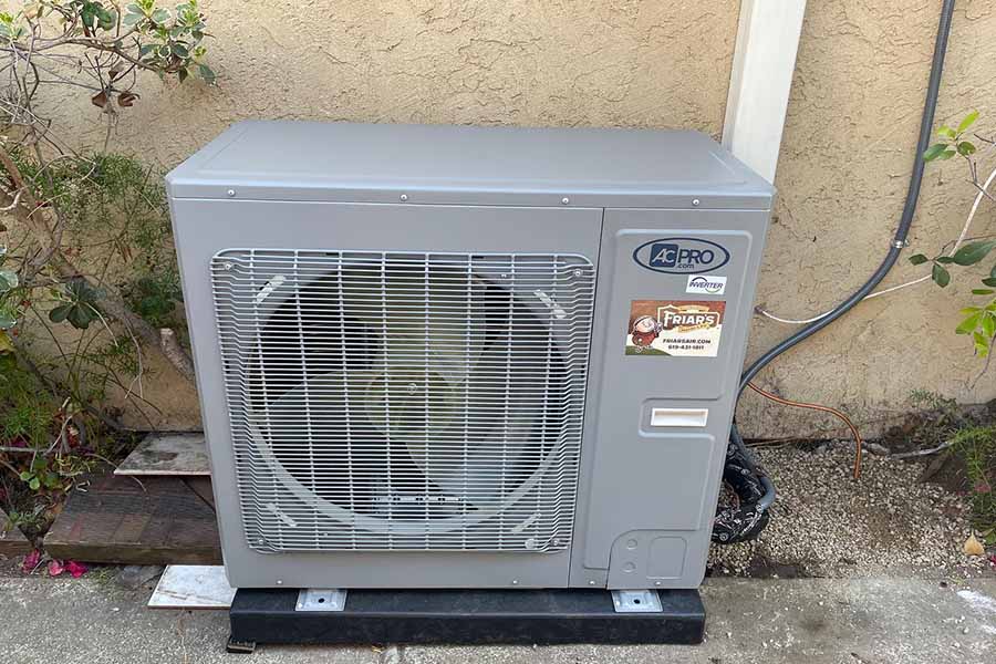 AC Pro outdoor air conditioning unit with Friar's Heating & Air sticker