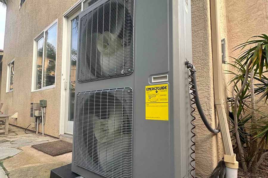 Outdoor AC condenser unit outside home during repair service