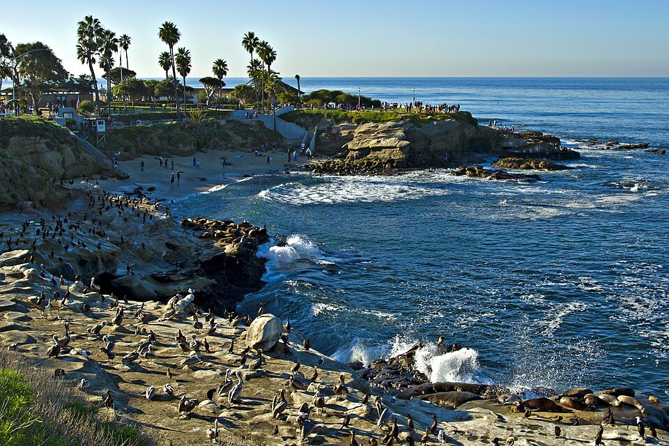 La Jolla Cove San Diego with sandstone cliffs and calm blue water at the shoreline